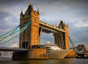 Cruise ship passing London's Tower Bridge at sunset